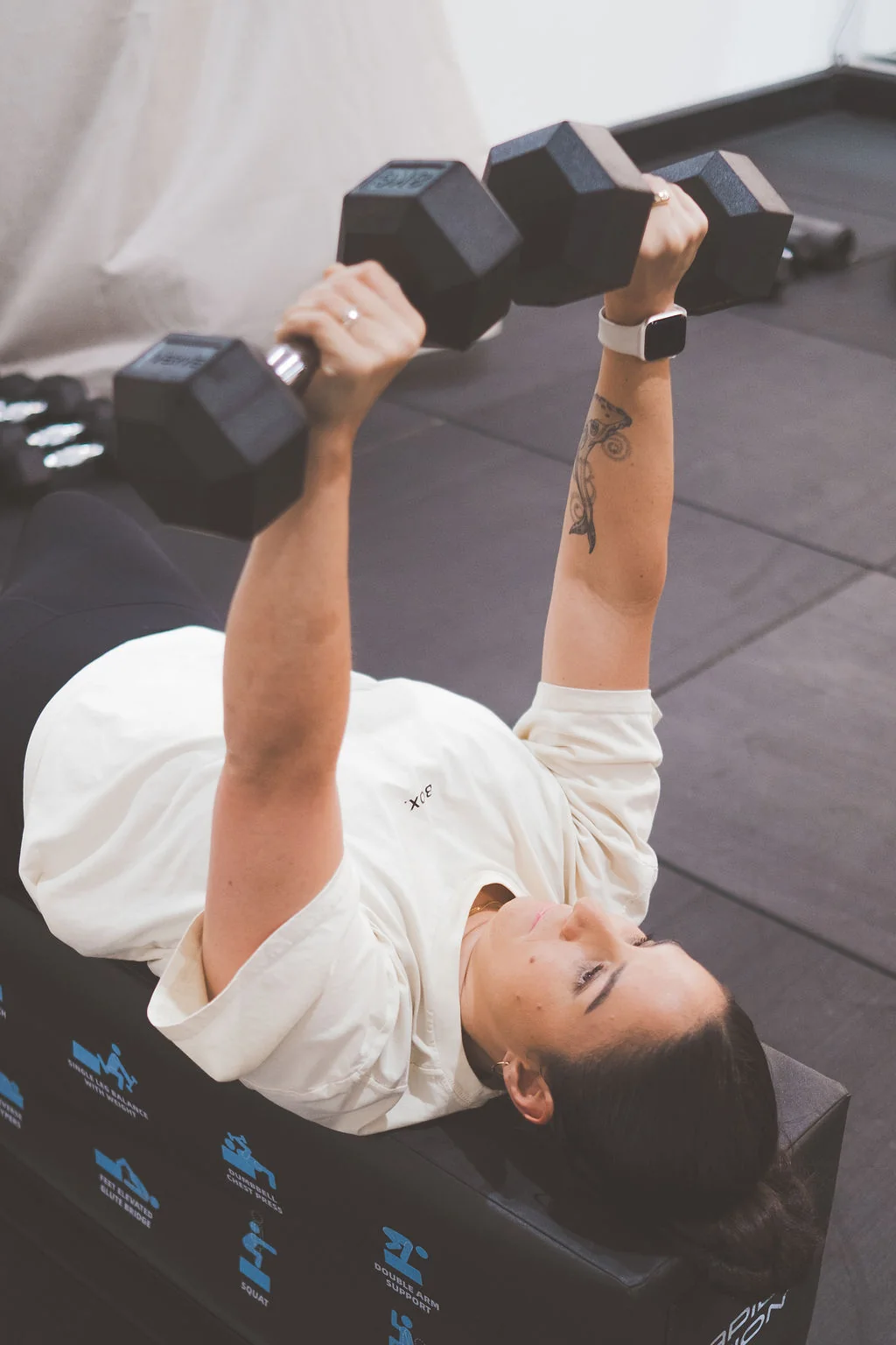 Woman strength training with dumbbells at BOX. Boutique Gym in Newcastle